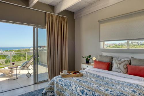 Ένα ή περισσότερα κρεβάτια σε δωμάτιο στο Stanford's Cove Villas