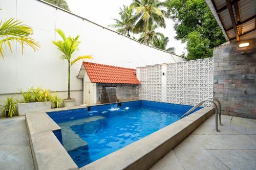 Bazén v ubytování OV Private Pool Villas near Baga, I 4BHK units I Staff nebo v jeho okolí