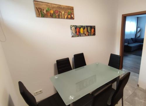 a meeting room with a white table and chairs at Panorama Apartmenthaus in Vöcklamarkt