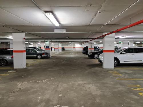 a parking garage filled with lots of parked cars at ECONOMY downtown design apartments - FREE PARKING - balcony - super puplic transport - AC in Budapest