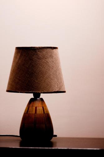 a lamp sitting on top of a table at Melies Hotel in Kokkinórrakhi