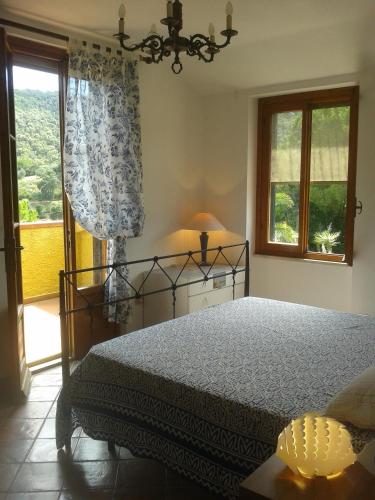 Ein Bett oder Betten in einem Zimmer der Unterkunft Parco delle Ginestre