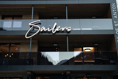 a sign on the side of a building at Luxury Apart Sailers including Premium Summercard in Sankt Anton am Arlberg