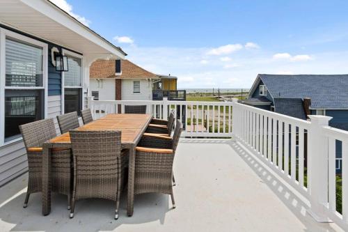 a deck with a wooden table and chairs at Renovated Beach Block 7BR North Beach Atlantic City - Steps to Beach & Casino in Atlantic City