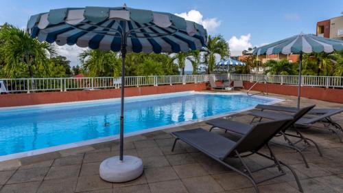 Afbeelding uit fotogalerij van Studio climatisé dans Résidence avec piscine, à proximité de la mer in La Trinité