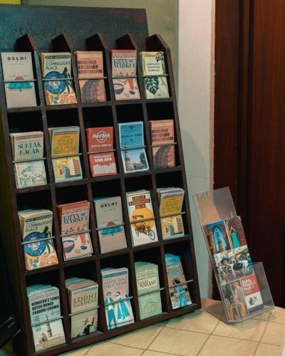 a book shelf filled with lots of books at Tree of Life Bed & Breakfast in New Delhi