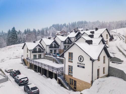 an aerial view of a resort in the snow at Chalet Fomich in Bukovel