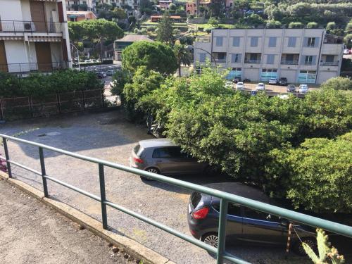 a car parked in a parking lot with trees at Casa Angelo in Recco