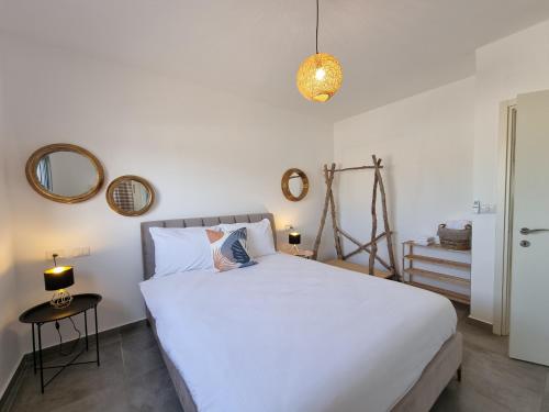 En eller flere senge i et værelse på Casa 2 Mitzpe Ramon