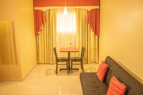 Coin salon dans l'établissement Orquidea Limon Hotel Boutique