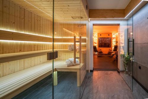 a sauna with a bench in a room at Apartamenty Pod Gubałówką in Zakopane