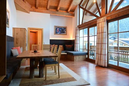 a living room with a table and a couch at Residence Martha in Biberwier