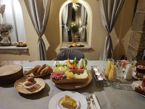 a table with a tray of food on it at Penzion Přívoz in Hřensko