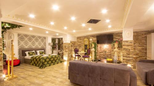 a living room with a bed and a fireplace at Terrace Tbilisi Center in Tbilisi City