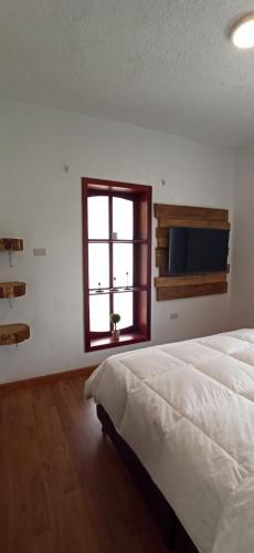 Postel nebo postele na pokoji v ubytování Hacienda El Castillo Hotel Boutique