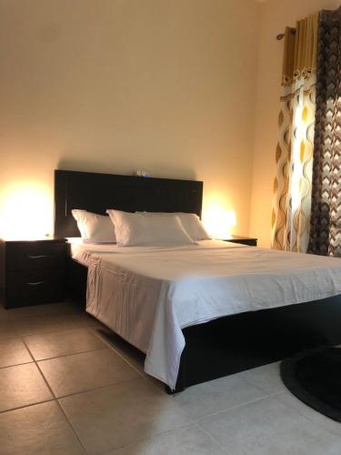 Un pat sau paturi într-o cameră la Kaya Hostel