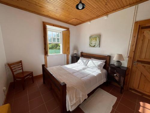 Postel nebo postele na pokoji v ubytování Casa do Bicho Pau