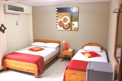 Ένα ή περισσότερα κρεβάτια σε δωμάτιο στο Hostal Quil
