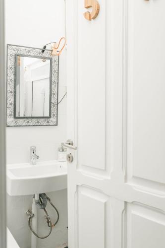 a bathroom with a sink and a mirror at Mapango Small Rooms in Santa Cruz de Tenerife