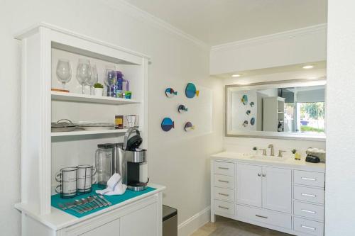 a kitchen with a counter with a coffee maker on it at Room 127 - Waterfront, Heated Pool, Huge TV, Tiki Bar & Grill in Sarasota