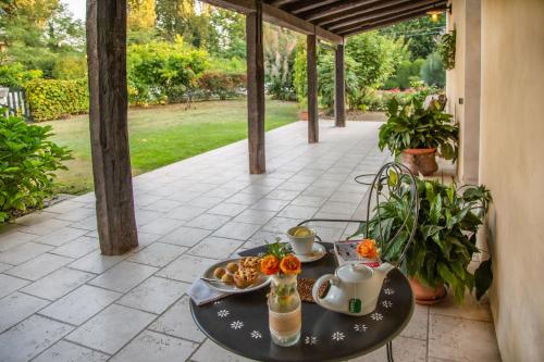 a table with a tray of food on a patio at Ca' Dei Molini in Gruaro
