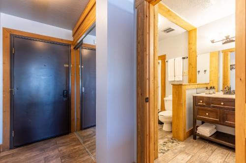 a bathroom with a toilet and a sink at Hotel Style Room in The Timber Creek Lodge condo in Truckee