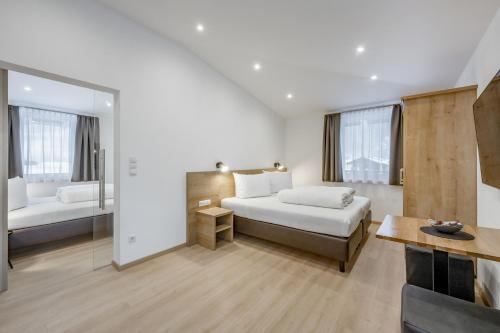 Un pat sau paturi într-o cameră la Apart Holzknecht