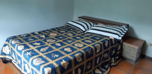 Cama o camas de una habitación en 0108.00 - Casa - Maranduba - 4 Dormitórios - 12 Pessoas - Churrasqueira - 1 Quadra do Mar