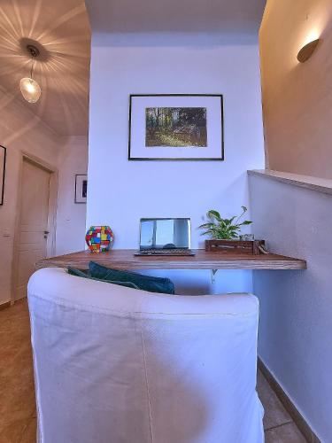 a living room with a white couch in a room at Villa Boukari in Chlomós