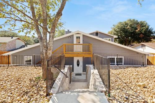 a home with a deck on a house at CYC Eclectic Back House with BBQ Gazebo in San Antonio