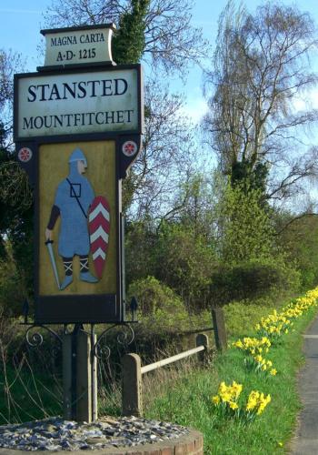 a sign for a hamasted mountainintendent on the side of a road at Modern Luxury 1 bed apartment with parking near Stansted Airport in Stansted Mountfitchet