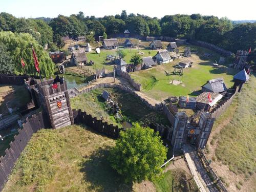 an aerial view of a castle with a yard at Modern Luxury 1 bed apartment with parking near Stansted Airport in Stansted Mountfitchet