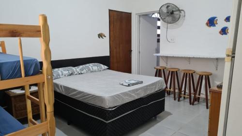 Ein Bett oder Betten in einem Zimmer der Unterkunft Hospedaria Canto Ubuntu Kitnet