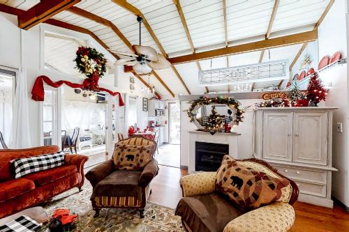 a living room filled with furniture and a fireplace at A Precious Place in Gatlinburg