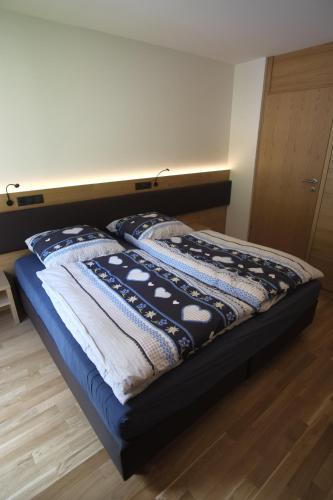 Katil atau katil-katil dalam bilik di Ferienwohnung Arlberg