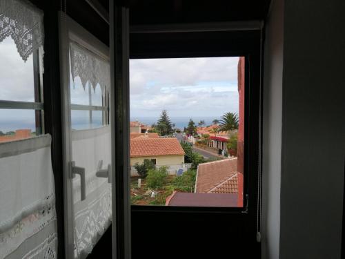 a window with a view of a city at Villa La Victoria in Tegueste