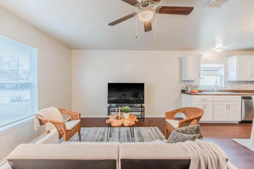 a living room with a couch and a ceiling fan at 3Bedroom 2Bathroom close to historic downtown fast wifi in McKinney