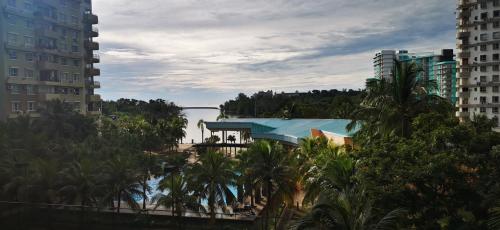 a view of a city with palm trees and a river at BayView Villas Condo - Premium Unit in Port Dickson