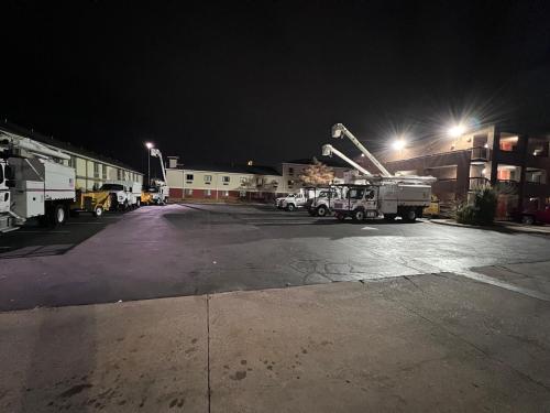a group of trucks parked in a parking lot at night at Motel 6 Oklahoma City OK Fairgrounds West in Oklahoma City