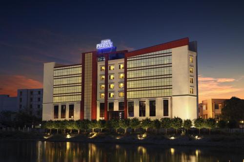 a hotel building with a sign on top of it at Le Lac Sarovar Portico- Ranchi in Rānchī