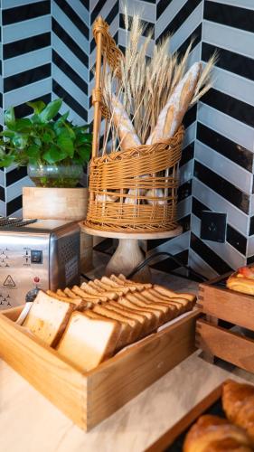 a display of bread and baskets on a table at Radisson RED Hotel Zhuhai Gongbei Port in Zhuhai
