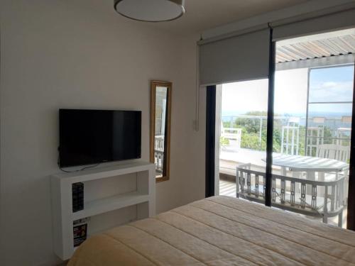 Televiisor ja/või meelelahutuskeskus majutusasutuses TERRAZAS DE LA COMARCA