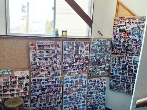 a wall of photos on the wall of a room at Ishiuchi Ski Center in Minami Uonuma