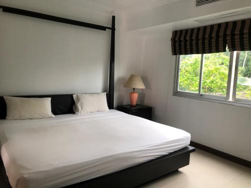 Krevet ili kreveti u jedinici u objektu Orchid Kathu Heights Service Apartments
