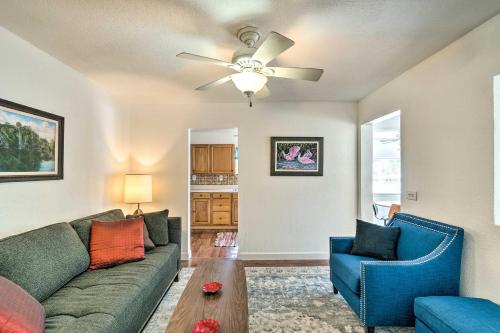 a living room with a couch and a ceiling fan at Tropical Port Charlotte Cottage - Walk to Bay! in Port Charlotte