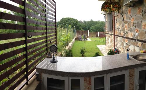 a view of a garden from a balcony of a house at Zapovedni Rai in Primorsko