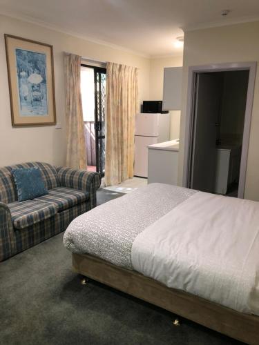 Postel nebo postele na pokoji v ubytování Evancourt Motel Malvern East
