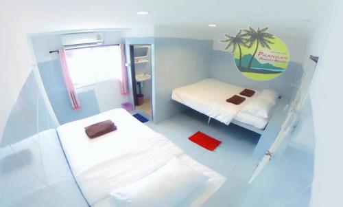 Postel nebo postele na pokoji v ubytování Phangan Mantra Inn