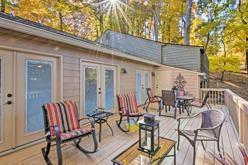 a deck with chairs and tables on a house at Comfy Jasper Getaway with Community Amenities! in Jasper