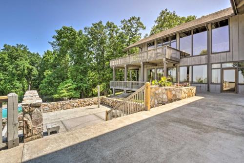 an exterior view of a large house with a balcony at Comfy Jasper Getaway with Community Amenities! in Jasper